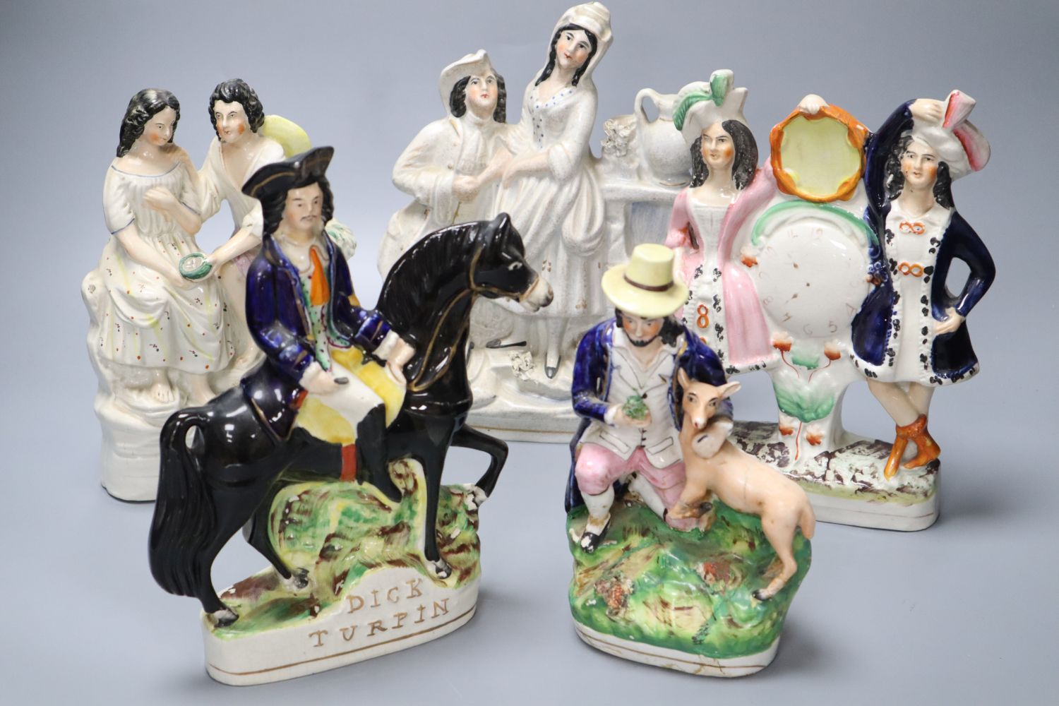 Five 19th century Staffordshire pottery figures including Dick Turpin, later 24cm